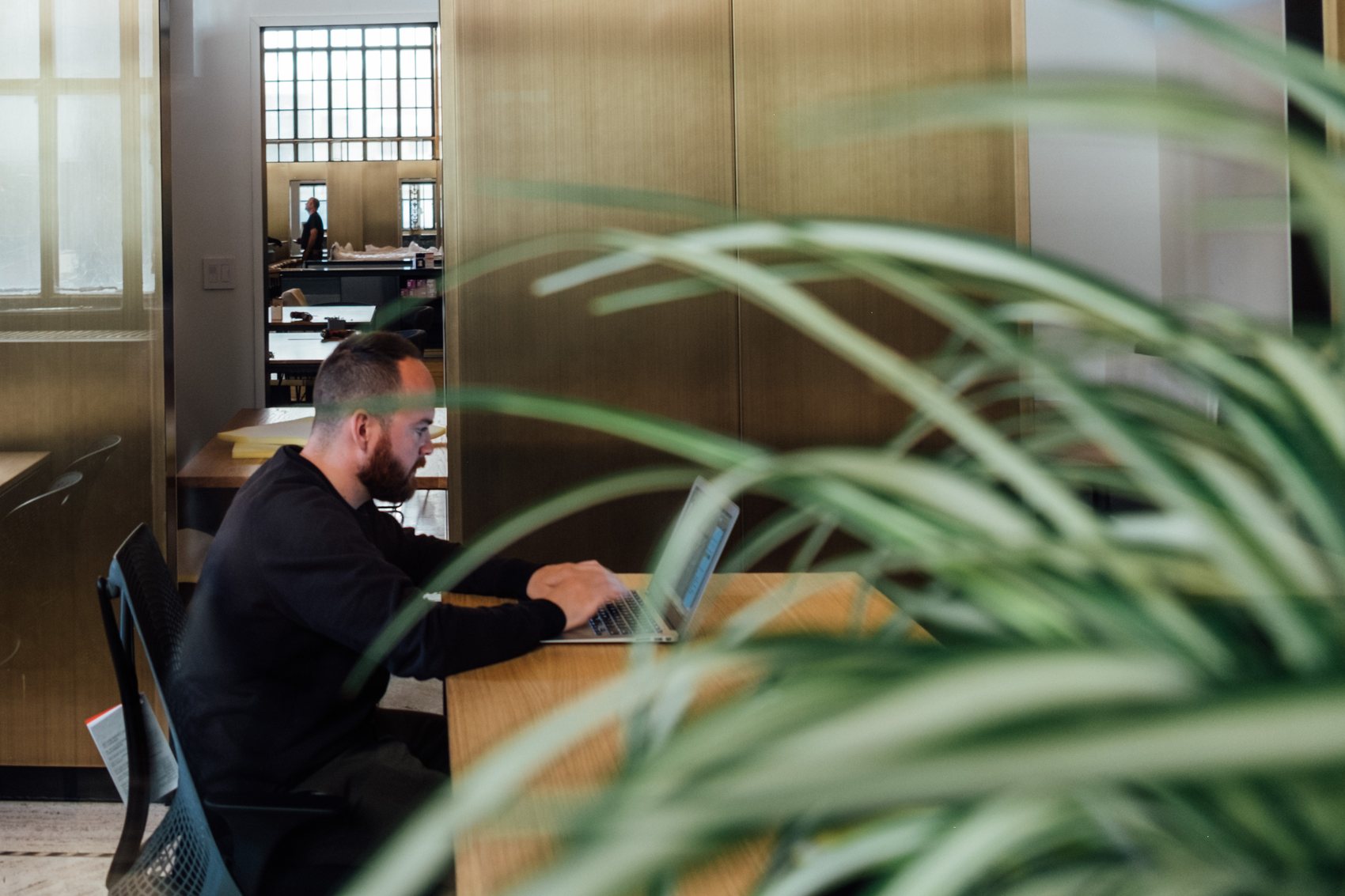 Team member working at a desk in a modern office