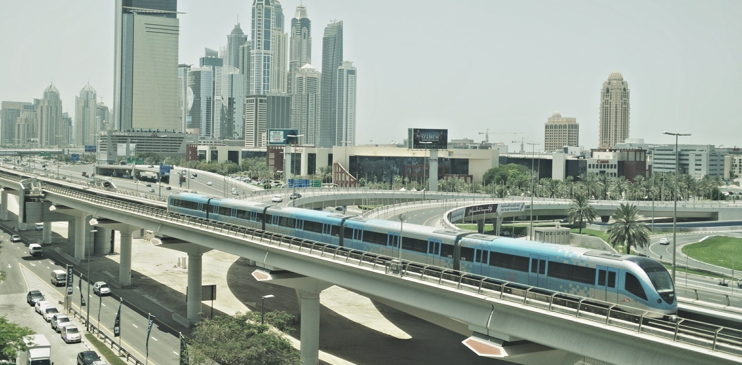 Dubai Metro and Sheikh Zayed Road skyline by day
