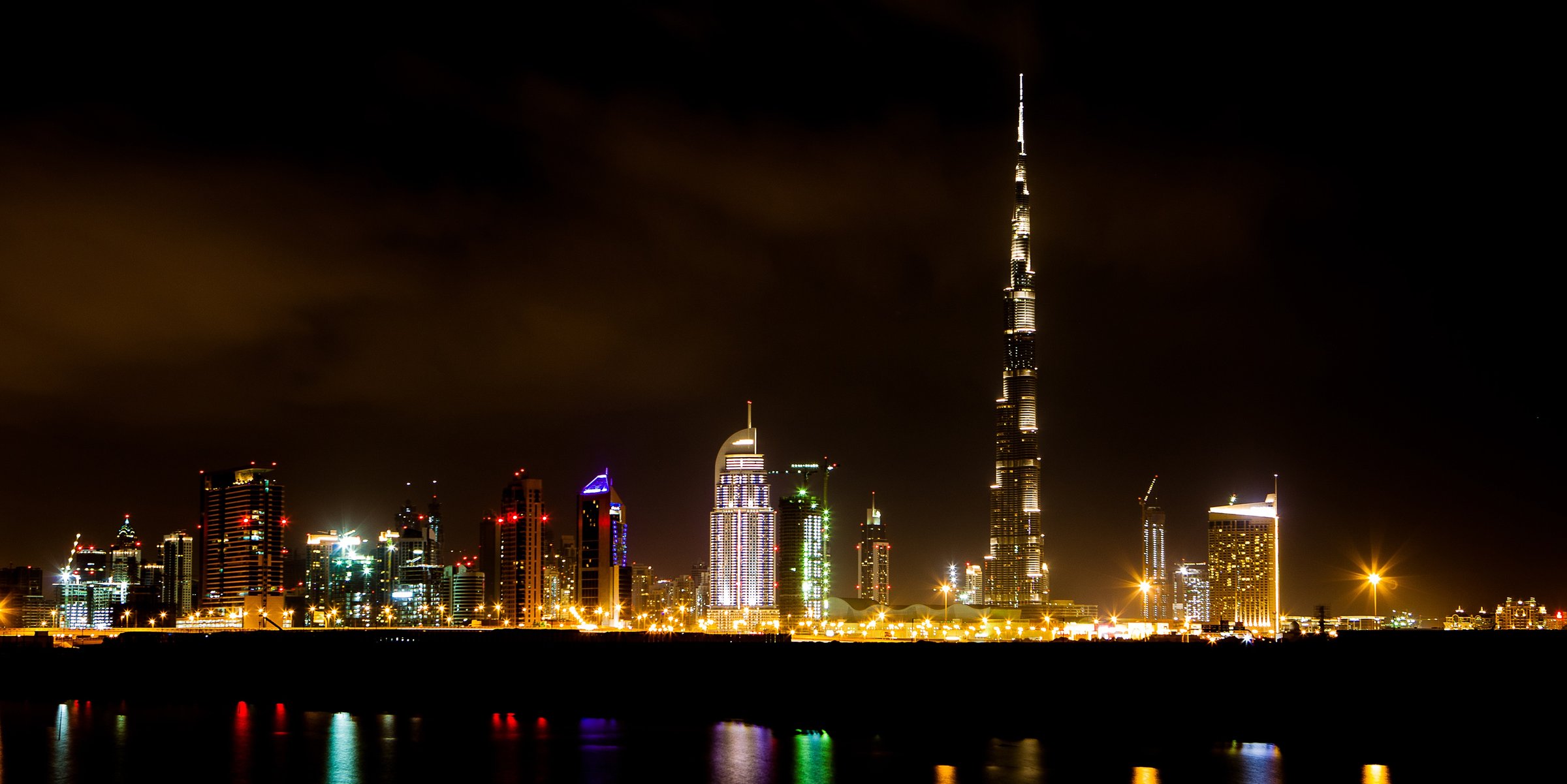 Dubai skyline reflected at night
