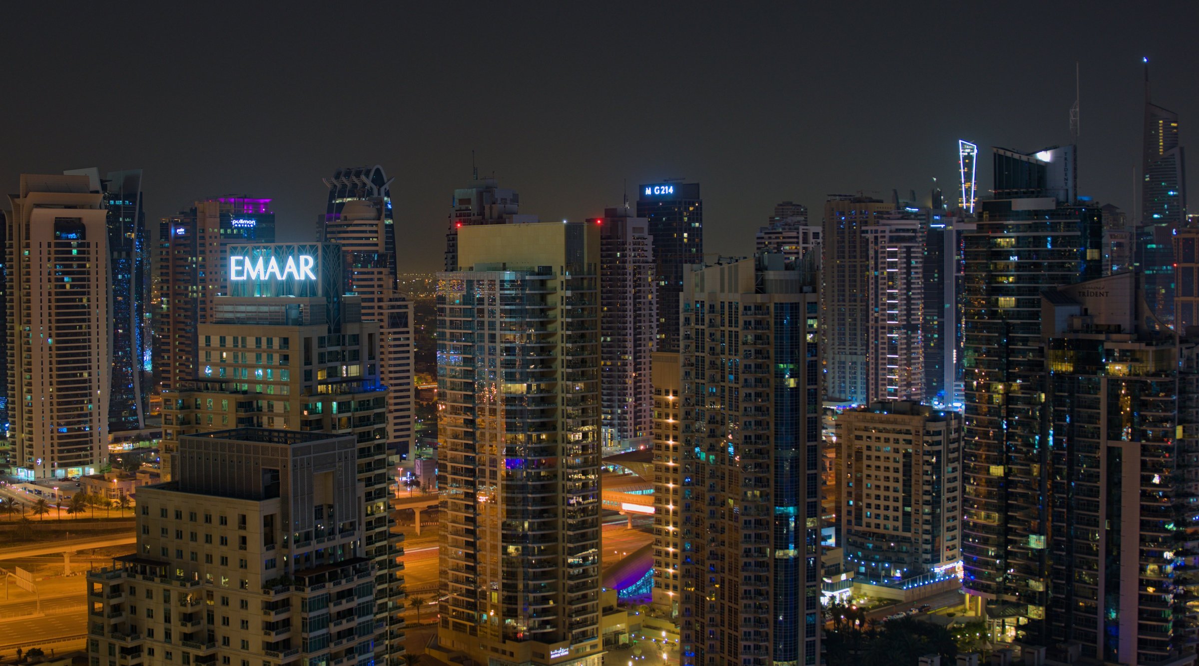 Modern glass tower illuminated at night