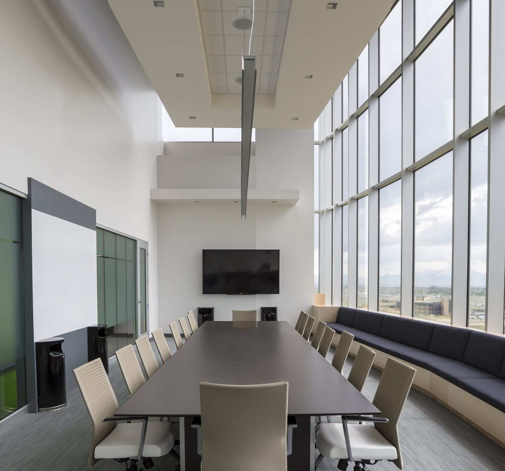 Modern boardroom with city view windows