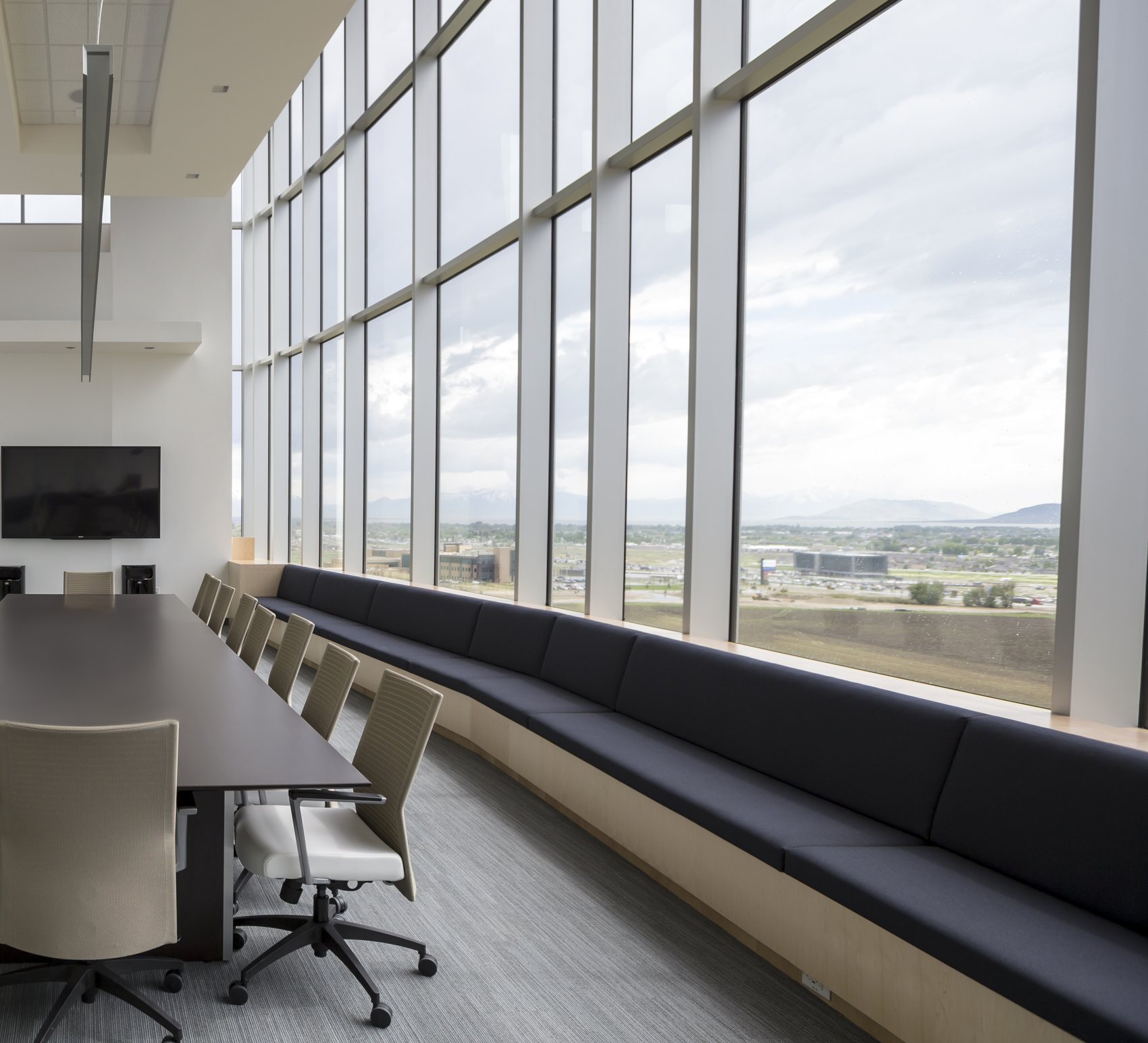 Boardroom seating area with floor-to-ceiling windows